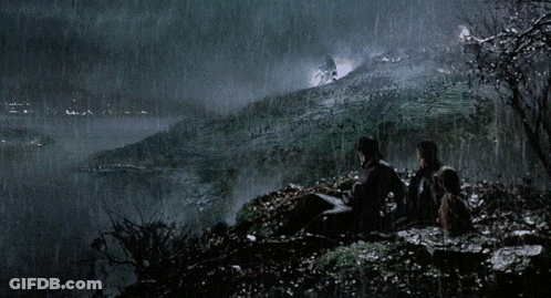 Group Sitting On Hill Looking At Waterfall GIF