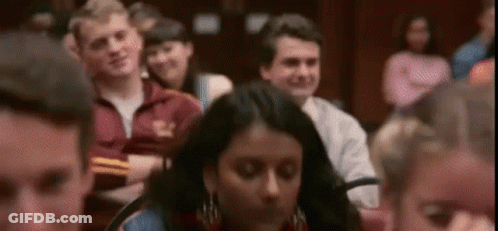 Group Sitting With Arms Crossed Looking At Something GIF