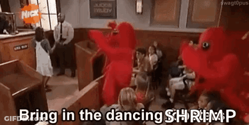 Group Sitting With Red Stuffed Animal GIF