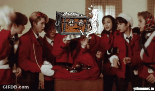 Group Standing Around Box With Cartoon Face GIF