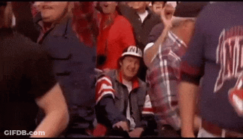 Group Standing Around Man In Wheelchair GIF