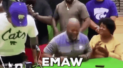 Group Standing Around Man Signing Document GIF