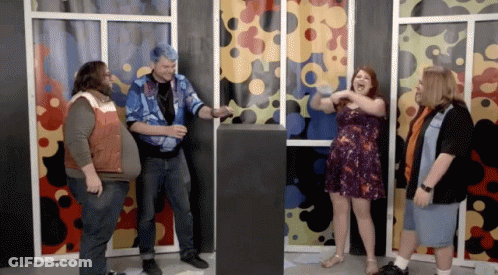 Group Standing Around Podium With Woman Screaming GIF