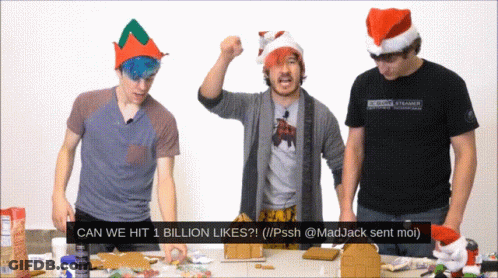 Group Standing Around Table Saying Can We Hit 1 Billion Likes GIF
