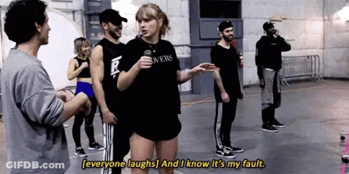 Group Standing Around Woman With Microphone GIF