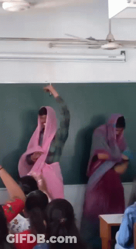 Group Standing At Blackboard With Pink Veil GIF