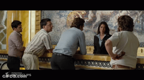 Group Standing At Counter With Movieclips GIF