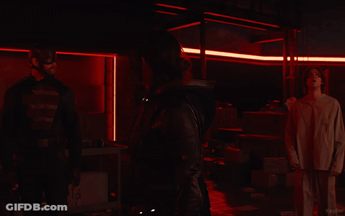 Group Standing In Dark Room With Kepler GIF
