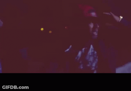 Group Standing In Dark With Number 20 Hoodie GIF
