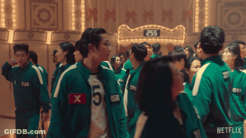 Group Standing In Front Of 255 Sign GIF
