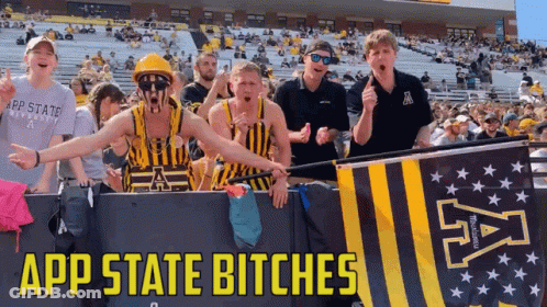 Group Standing In Front Of App State Bitches Banner GIF