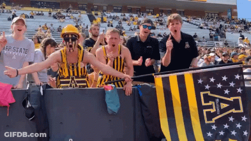 Group Standing In Front Of App State University Banner GIF