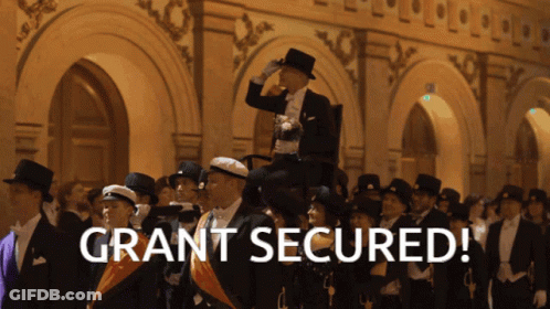 Group Standing In Front Of Building Grant Secured GIF
