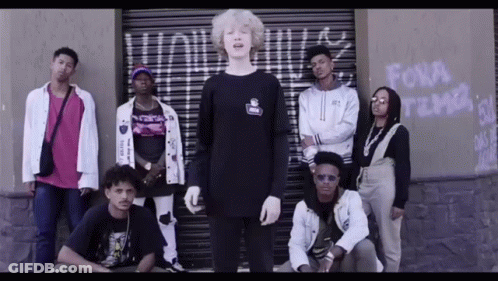 Group Standing In Front Of Building Saying Fora GIF