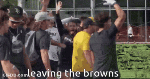 Group Standing In Front Of Building Saying Leaving The Browns GIF