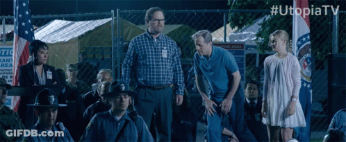 Group Standing In Front Of Chain Link Fence #Utopiatv GIF
