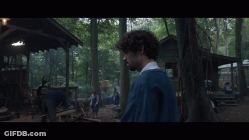 Group Standing In Front Of Hello Bright Building GIF