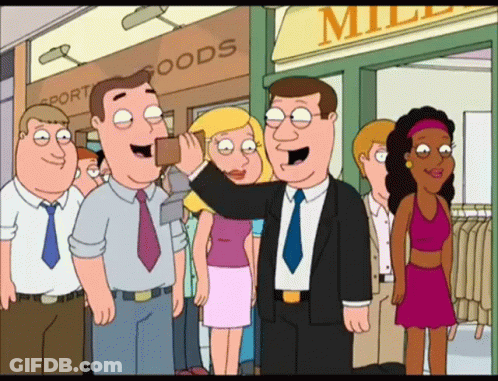 Group Standing In Front Of Miller Sport Goods Store GIF