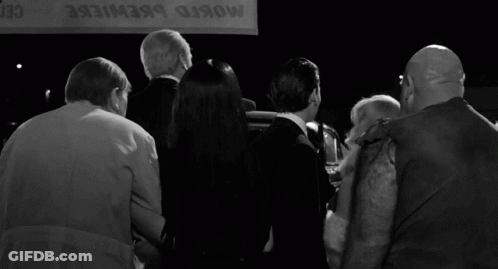 Group Standing In Front Of Mosko Brewiere Sign GIF