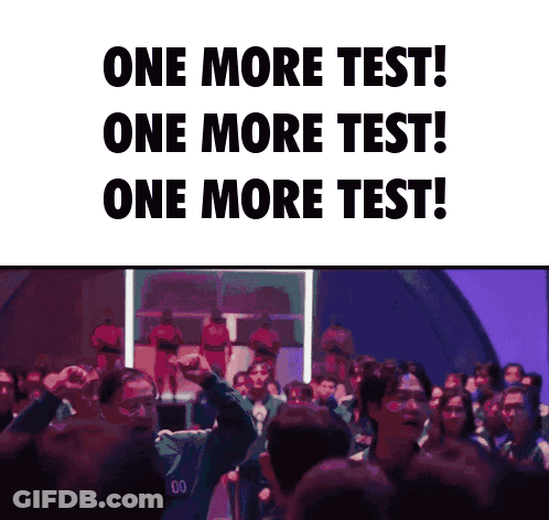 Group Standing In Front Of One More Test Sign GIF