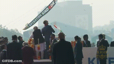 Group Standing In Front Of Operation Sind Or Banner GIF