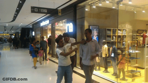 Group Standing In Front Of Pepe Jeans Store GIF