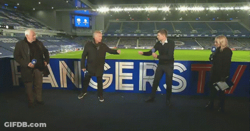 Group Standing In Front Of Rangers TV Banner GIF