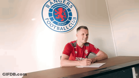 Group Standing In Front Of Rangers TV Banner GIF