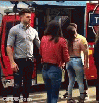 Group Standing In Front Of Red Fire Truck GIF
