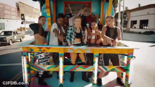 Group Standing In Front Of Reggae Wagon GIF