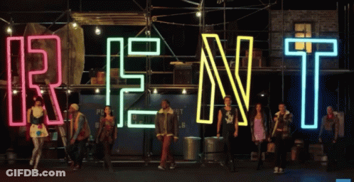 Group Standing In Front Of Rent Sign GIF