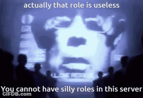 Group Standing In Front Of Screen Saying Actually That Role Is Useless GIF