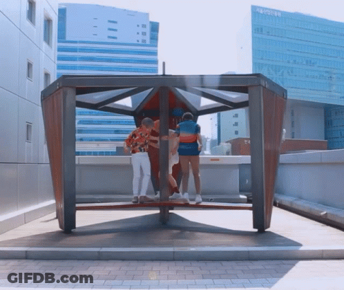 Group Standing In Front Of Seoul Building GIF