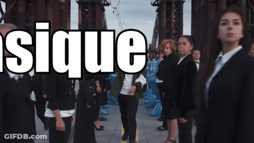 Group Standing In Front Of Sique Sign GIF