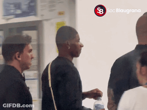 Group Standing In Front Of Soc Blaugrans Sign GIF