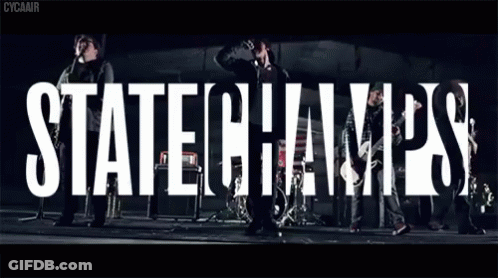 Group Standing In Front Of State Champs Sign GIF