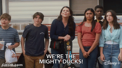 Group Standing In Front Of We're The Mighty Ducks Trailer GIF