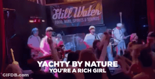 Group Standing In Front Of Yachty By Nature You're A Rich Girl Sign GIF