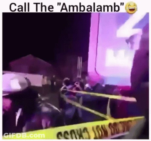 Group Standing In Front Of Yellow Caution Tape Saying Call The Ambalamb GIF