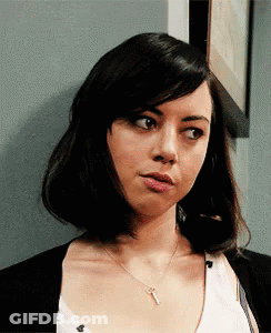 Group Standing In Front Of Zeus Wall GIF
