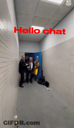 Group Standing In Hallway Saying Hello Chat GIF