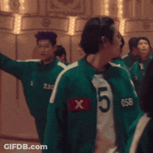 Group Standing In Room With Green Jersey Number 238 GIF