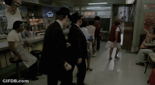Group Standing Near Crush Sign GIF