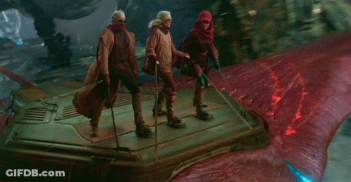Group Standing On Red Surface GIF