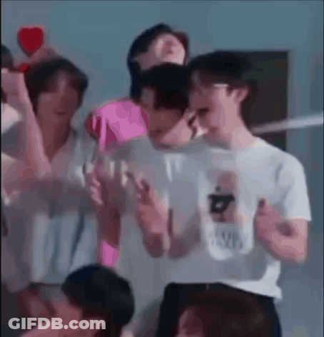 Group Standing With Pink Heart GIF