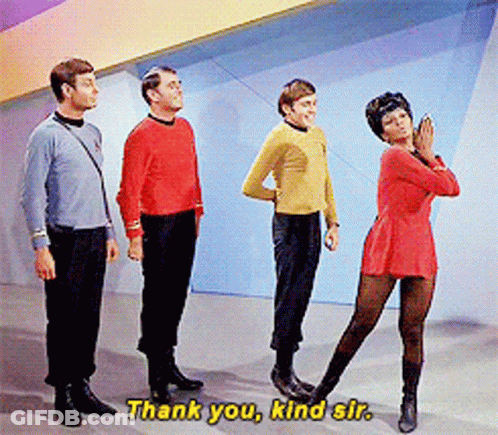 Group Standing With Woman In Red Dress Saying Thank You Kind Sir GIF