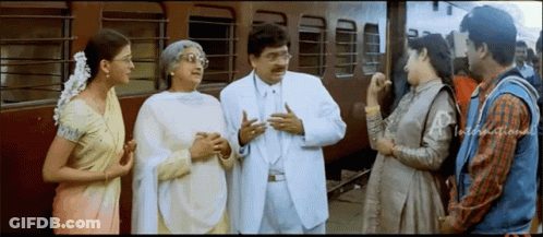 Group Talking Near Train GIF