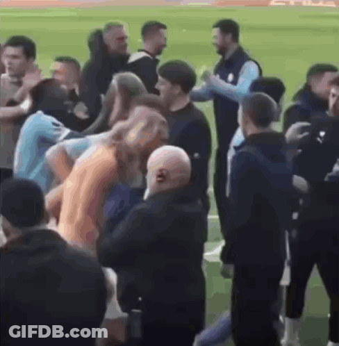 Group Talking On Soccer Field GIF