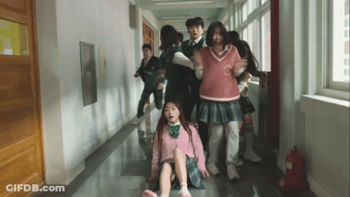 Group Walking Down Hallway With Fire Extinguisher GIF