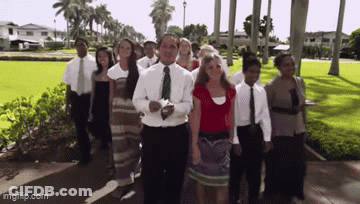 Group Walking Down Sidewalk GIF